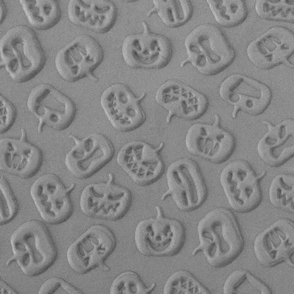 Texture Tile - Carved Pumpkins Embossed sample rolled into clay