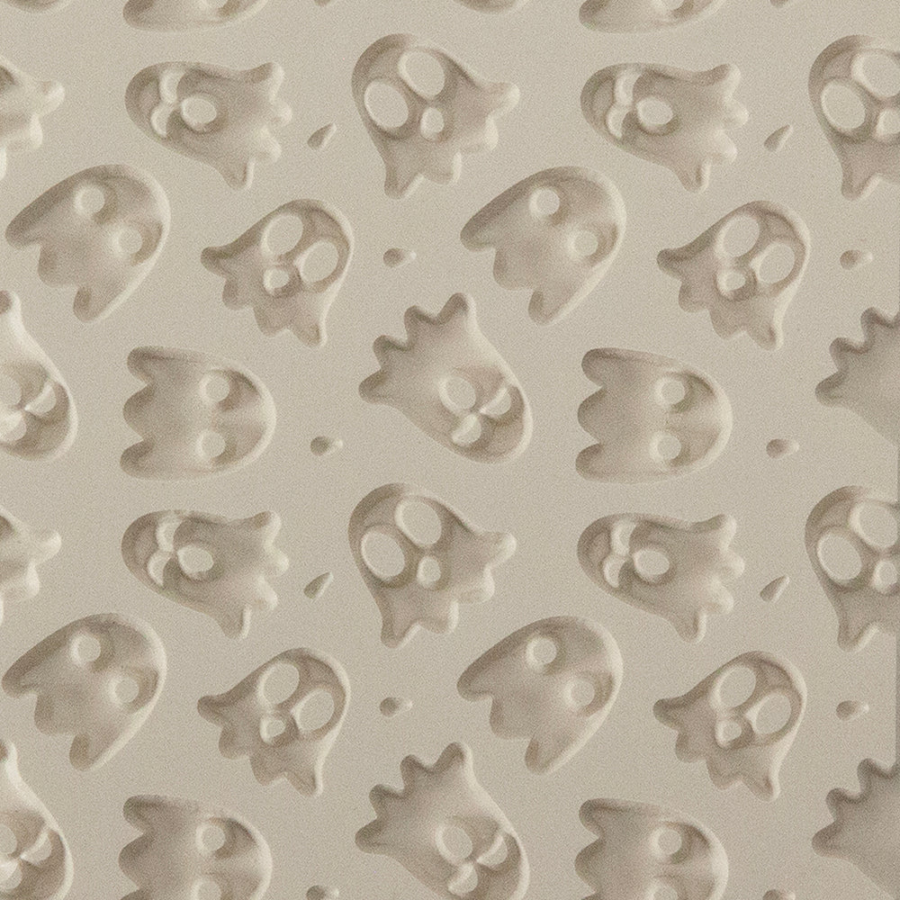 Texture Tile - Ghoulfriends Embossed. Beige Texture Tiles are flexible, washable and can be used with any soft clay. Spritz with CoolSlip or dust on Dry Powder Release for stick-free impressions when using metal clay and polymer clay.