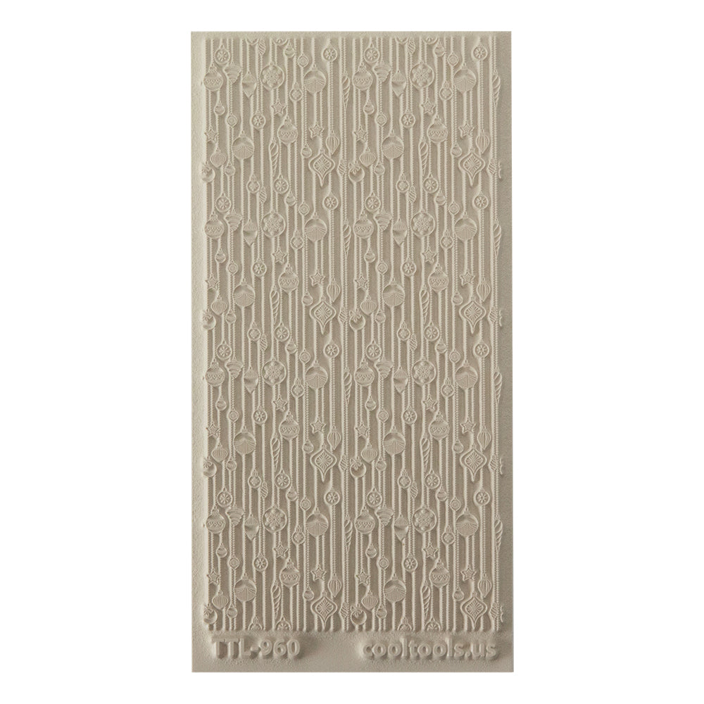 Texture Tile - 'Tis the Season. Beige Texture Tiles are flexible, washable and can be used with any soft clay. Spritz with CoolSlip or dust on Dry Powder Release for stick-free impressions when using metal clay and polymer clay.