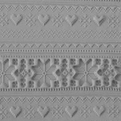 Texture Tile - Christmas Sweater Embossed sample rolled into clay