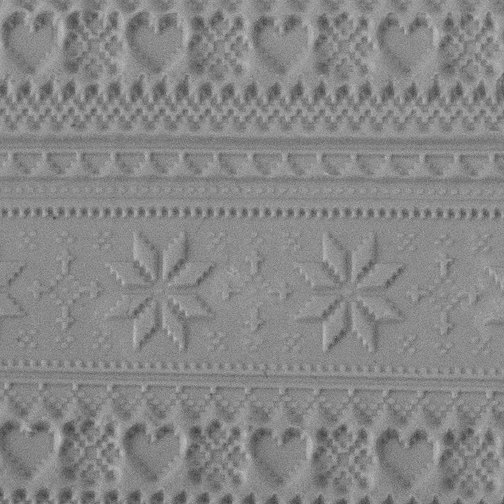 Texture Tile - Christmas Sweater sample rolled into clay