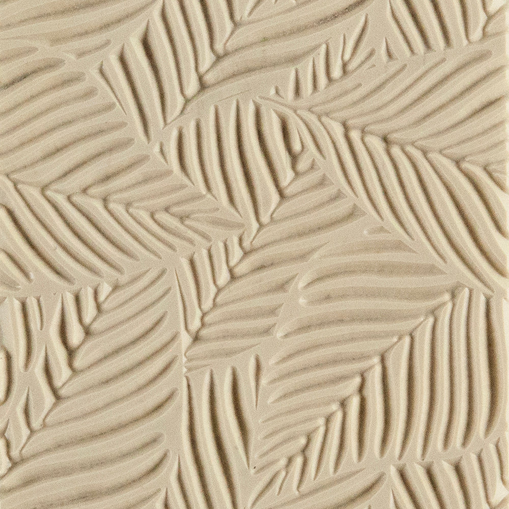 Texture Tile - Palm Leaves Embossed. Texture Tiles are flexible, washable and can be used with any soft clay. Spritz with CoolSlip or dust on Dry Powder Release for stick-free impressions when using metal clay and polymer clay.