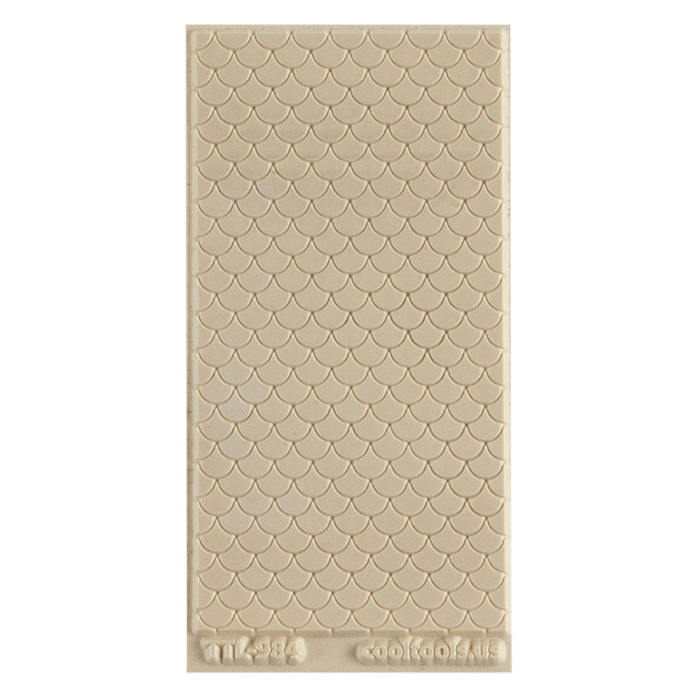 Texture Tile - Scales Embossed. Texture Tiles are flexible, washable and can be used with any soft clay. Spritz with CoolSlip or dust on Dry Powder Release for stick-free impressions when using metal clay and polymer clay.