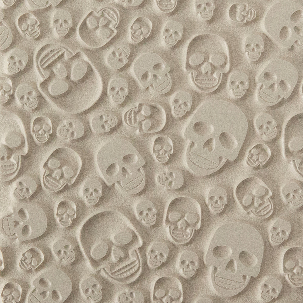 Texture Tile - Skulls. Beige Texture Tiles are flexible, washable and can be used with any soft clay. Spritz with CoolSlip or dust on Dry Powder Release for stick-free impressions when using metal clay and polymer clay.