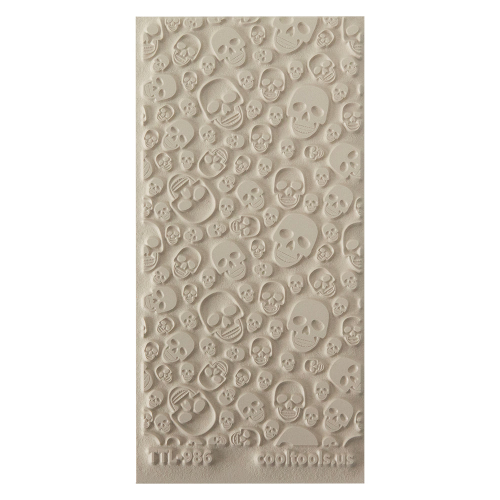 Texture Tile - Skulls. Beige Texture Tiles are flexible, washable and can be used with any soft clay. Spritz with CoolSlip or dust on Dry Powder Release for stick-free impressions when using metal clay and polymer clay.