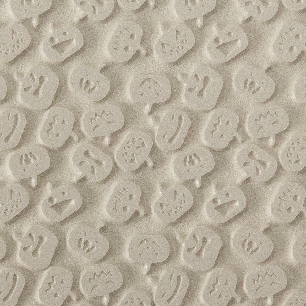 Texture Tile - Carved Pumpkins. Beige Texture Tiles are flexible, washable and can be used with any soft clay. Spritz with CoolSlip or dust on Dry Powder Release for stick-free impressions when using metal clay and polymer clay.