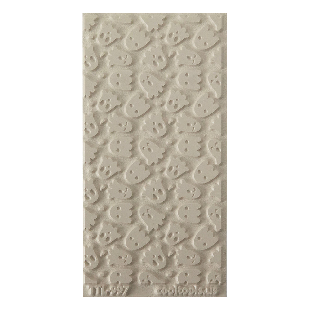 Texture Tile - Ghoulfriends. Beige Texture Tiles are flexible, washable and can be used with any soft clay. Spritz with CoolSlip or dust on Dry Powder Release for stick-free impressions when using metal clay and polymer clay.