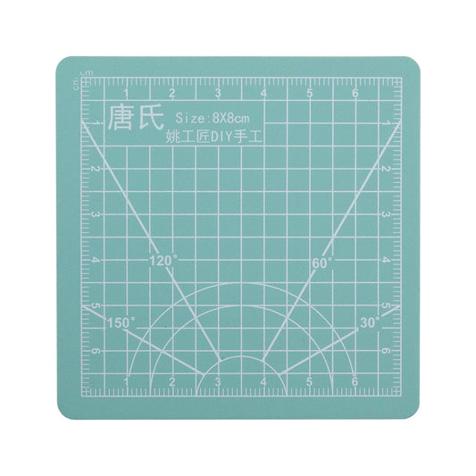 Double Sided PVC Cutting Mat - 3-1/8" x 3-1/8" This sturdy little mat can be used for cutting out your favorite designs or for moving your delicate clay pieces. PVC on both sides giving you extra cutting surface. Blank on one side with a grid on the other to help you get perfect lines or angles.