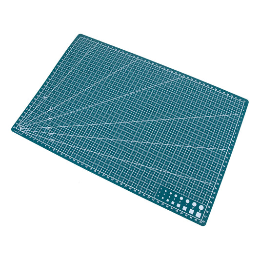 Double Sided PVC Cutting Mat and Work Surface - 12" x 18" This PVC mat can be used for cutting out your favorite designs or as a work surface to protect your work area. PVC on both sides gives you extra cutting surface. Blank on one side with a grid on the other to help you get perfect lines or angles.