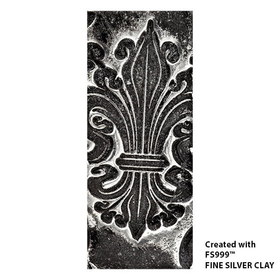 silver sample of Long Mega Texture Tile - Bold Fleur de Lis Even longer than our Mega Tiles, these textures measure 6" x 12" which makes them perfect for both large and small projects. Long Mega Texture Tiles are flexible, washable and can be used with any soft clay. Spritz with CoolSlip or dust on Dry Powder Release for stick-free impressions when using metal clay and polymer clay.