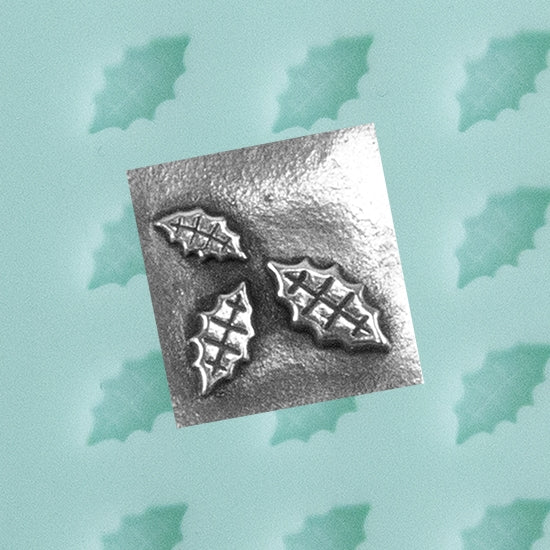 Finishing Touches Mold - Holly Leaf with silver sample - Cool Tools Finishing Touches are silicone molds specially designed to create precise and repeatable shapes and adornments for metal clay and polymer clay. Each mold is perfectly calibrated for jewelry and jewelry components.