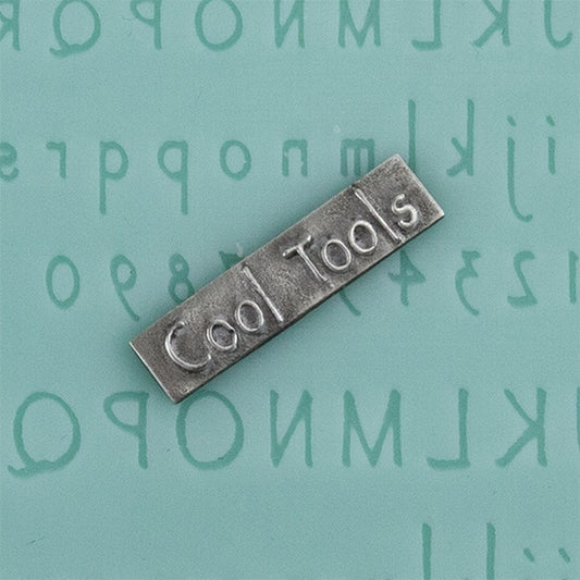 Finishing Touches Mold - Alphabet 6 - Flat with silver sample Cool Tools Finishing Touches are silicone molds specially designed to create precise and repeatable shapes and adornments for metal clay and polymer clay. Each mold is perfectly calibrated for jewelry and jewelry components.