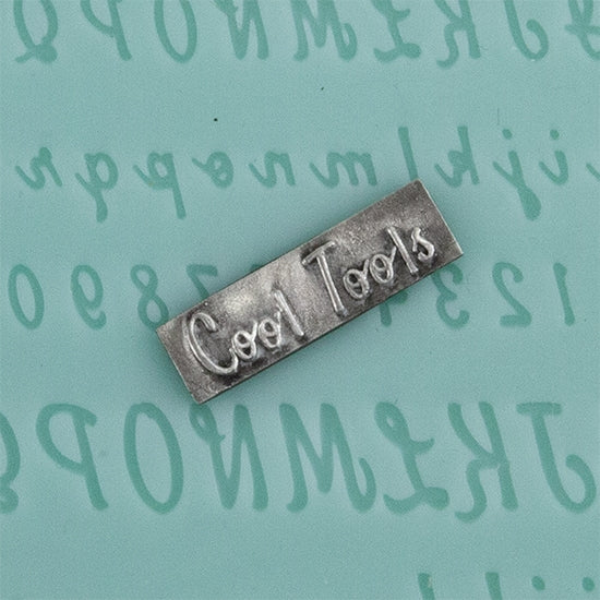 Finishing Touches Mold - Alphabet 7 - Flat with silver sample Cool Tools Finishing Touches are silicone molds specially designed to create precise and repeatable shapes and adornments for metal clay and polymer clay. Each mold is perfectly calibrated for jewelry and jewelry components.