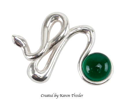 silver metal clay snake with emerald green glass round cabochone