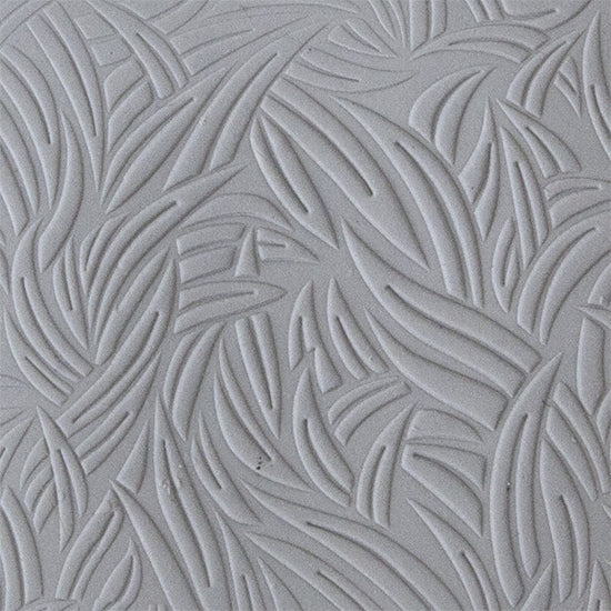 sample in clay of Mega Texture Tile - Grass Embossed. Use to impress texture in soft clays. Mega Texture Tiles are perfect for projects both large and small. Mega Tiles measure 9-1/4" x 6" and are about 7 times larger than Texture Tiles. These textures are flexible, washable and can be used with any soft clay.