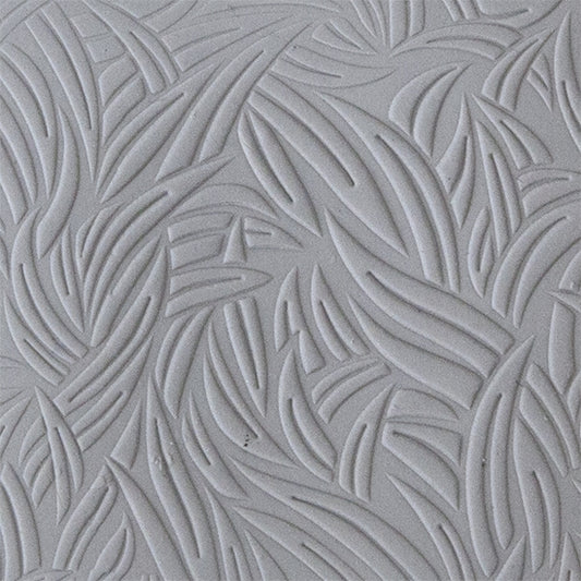 sample in clay of Mega Texture Tile - Grass Embossed. Use to impress texture in soft clays. Mega Texture Tiles are perfect for projects both large and small. Mega Tiles measure 9-1/4" x 6" and are about 7 times larger than Texture Tiles. These textures are flexible, washable and can be used with any soft clay.