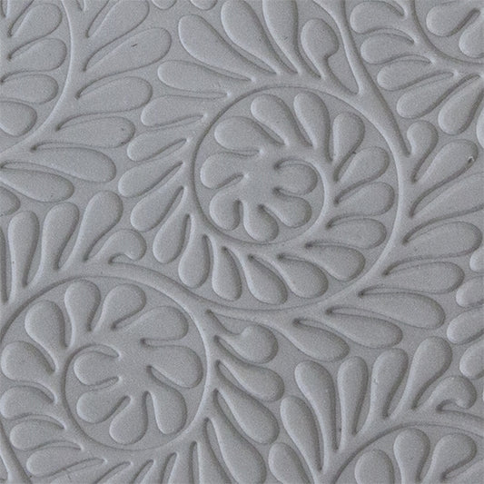 sample in clay of Mega Texture Tile - Fiddlehead Fern Embossed. Use to impress texture in soft clays. Mega Texture Tiles are perfect for projects both large and small. Mega Tiles measure 9-1/4" x 6" and are about 7 times larger than Texture Tiles. These textures are flexible, washable and can be used with any soft clay.