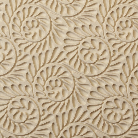 Mega Texture Tile - Fiddlehead Fern Embossed. Use to impress texture in soft clays. Mega Texture Tiles are perfect for projects both large and small. Mega Tiles measure 9-1/4" x 6" and are about 7 times larger than Texture Tiles. These textures are flexible, washable and can be used with any soft clay.