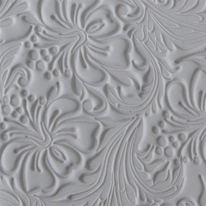 sample in clay of Mega Texture Tile - Hibiscus. Use to impress texture in soft clays. Mega Texture Tiles are perfect for projects both large and small. Mega Tiles measure 9-1/4" x 6" and are about 7 times larger than Texture Tiles. These textures are flexible, washable and can be used with any soft clay.