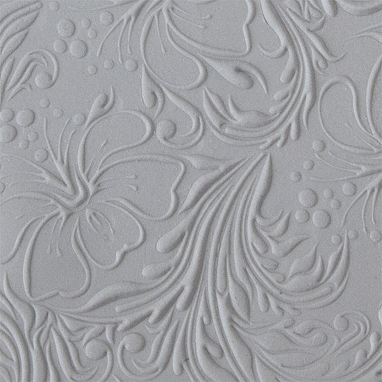 sample in clay of Mega Texture Tile - Hibiscus Embossed. Use to impress texture in soft clays. Mega Texture Tiles are perfect for projects both large and small. Mega Tiles measure 9-1/4" x 6" and are about 7 times larger than Texture Tiles. These textures are flexible, washable and can be used with any soft clay.