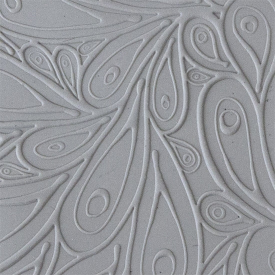 sample in clay of Mega Texture Tile - Peacock. Use to impress texture in soft clays. Mega Texture Tiles are perfect for projects both large and small. Mega Tiles measure 9-1/4" x 6" and are about 7 times larger than Texture Tiles. These textures are flexible, washable and can be used with any soft clay.