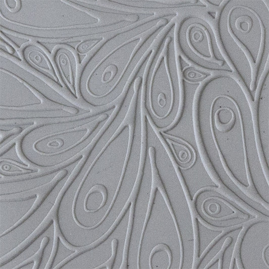 sample in clay of Mega Texture Tile - Peacock. Use to impress texture in soft clays. Mega Texture Tiles are perfect for projects both large and small. Mega Tiles measure 9-1/4" x 6" and are about 7 times larger than Texture Tiles. These textures are flexible, washable and can be used with any soft clay.