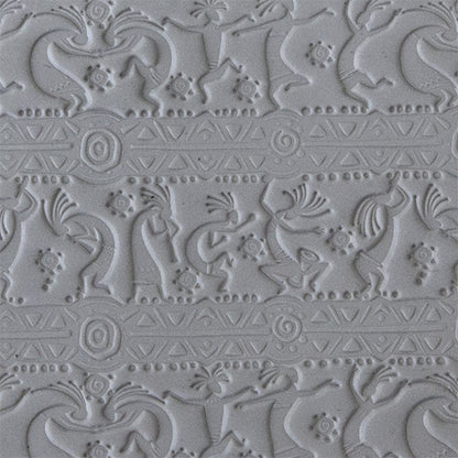 sample in clay of Mega Texture Tile - Dancing Spirits. Use to impress texture in soft clays. Mega Texture Tiles are perfect for projects both large and small. Mega Tiles measure 9-1/4" x 6" and are about 7 times larger than Texture Tiles. These textures are flexible, washable and can be used with any soft clay.