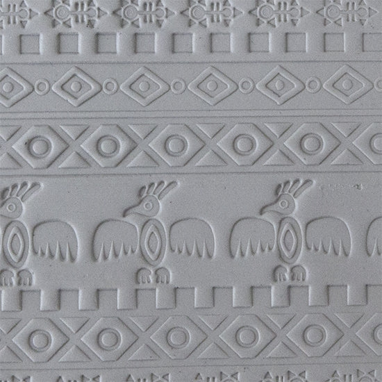 sample in clay of Mega Texture Tile - Tribal Spirits Embossed. Use to impress texture in soft clays. Mega Texture Tiles are perfect for projects both large and small. Mega Tiles measure 9-1/4" x 6" and are about 7 times larger than Texture Tiles. These textures are flexible, washable and can be used with any soft clay.