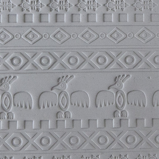 sample in clay of Mega Texture Tile - Tribal Spirits Embossed. Use to impress texture in soft clays. Mega Texture Tiles are perfect for projects both large and small. Mega Tiles measure 9-1/4" x 6" and are about 7 times larger than Texture Tiles. These textures are flexible, washable and can be used with any soft clay.