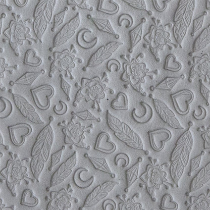 sample in clay of Mega Texture Tile - Lucky Charms. Use to impress texture in soft clays. Mega Texture Tiles are perfect for projects both large and small. Mega Tiles measure 9-1/4" x 6" and are about 7 times larger than Texture Tiles. These textures are flexible, washable and can be used with any soft clay.
