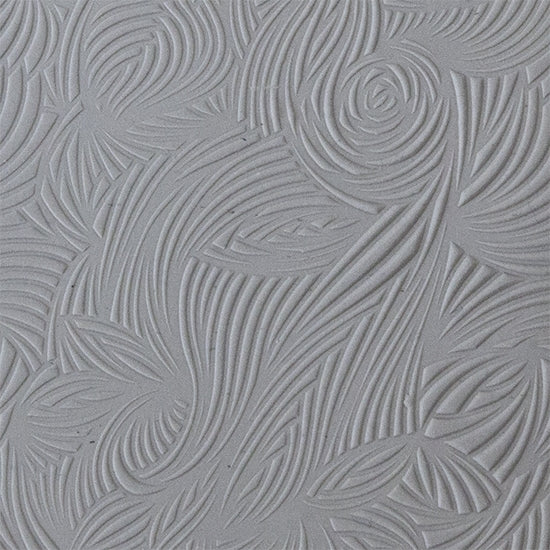 sample in clay of Mega Texture Tile - Floral Scrolls. Use to impress texture in soft clays. Mega Texture Tiles are perfect for projects both large and small. Mega Tiles measure 9-1/4" x 6" and are about 7 times larger than Texture Tiles. These textures are flexible, washable and can be used with any soft clay.