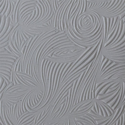 sample in clay of Mega Texture Tile - Floral Scrolls. Use to impress texture in soft clays. Mega Texture Tiles are perfect for projects both large and small. Mega Tiles measure 9-1/4" x 6" and are about 7 times larger than Texture Tiles. These textures are flexible, washable and can be used with any soft clay.