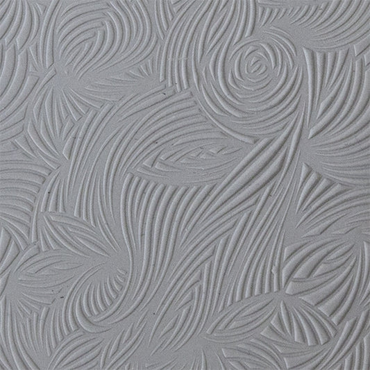 sample in clay of Mega Texture Tile - Floral Scrolls. Use to impress texture in soft clays. Mega Texture Tiles are perfect for projects both large and small. Mega Tiles measure 9-1/4" x 6" and are about 7 times larger than Texture Tiles. These textures are flexible, washable and can be used with any soft clay.