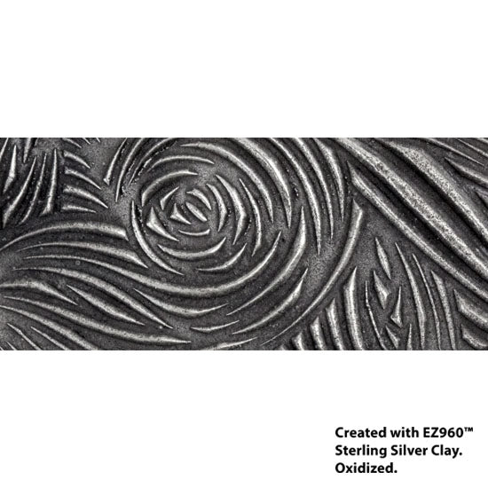 silver sample of Mega Texture Tile - Floral Scrolls. Use to impress texture in soft clays. Mega Texture Tiles are perfect for projects both large and small. Mega Tiles measure 9-1/4" x 6" and are about 7 times larger than Texture Tiles. These textures are flexible, washable and can be used with any soft clay.