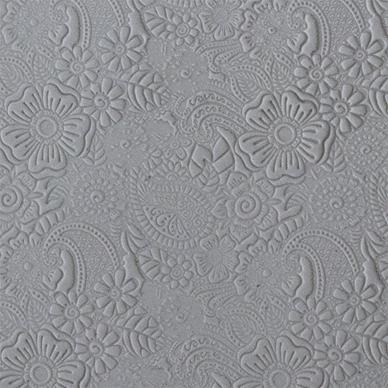 sample in clay Mega Texture Tile - Daisy Paisley. Use to impress texture in soft clays. Mega Texture Tiles are perfect for projects both large and small. Mega Tiles measure 9-1/4" x 6" and are about 7 times larger than Texture Tiles. These textures are flexible, washable and can be used with any soft clay.