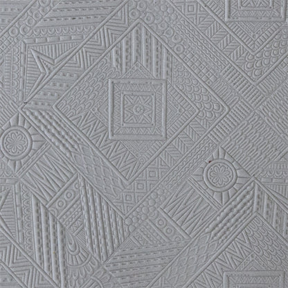 sample in clay of Mega Texture Tile - Geo Quilt. Use to impress texture in soft clays. Mega Texture Tiles are perfect for projects both large and small. Mega Tiles measure 9-1/4" x 6" and are about 7 times larger than Texture Tiles. These textures are flexible, washable and can be used with any soft clay.
