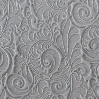 sample in clay of Mega Texture Tile - Plume. Use to impress texture in soft clays. Mega Texture Tiles are perfect for projects both large and small. Mega Tiles measure 9-1/4" x 6" and are about 7 times larger than Texture Tiles. These textures are flexible, washable and can be used with any soft clay.