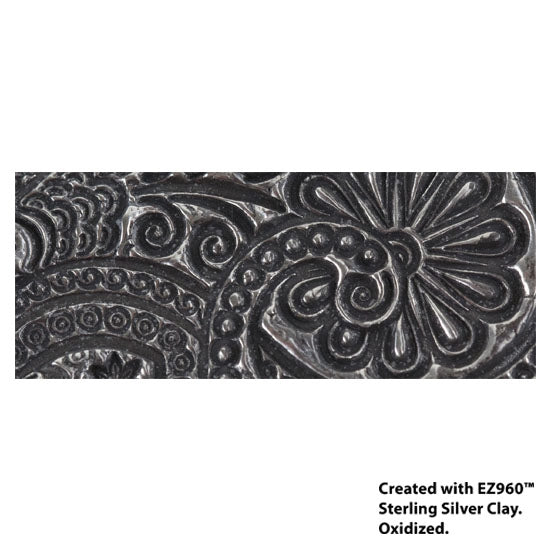 silver sample of Mega Texture Tile - Eastern Paisley. Use to impress texture in soft clays. Mega Texture Tiles are perfect for projects both large and small. Mega Tiles measure 9-1/4" x 6" and are about 7 times larger than Texture Tiles. These textures are flexible, washable and can be used with any soft clay.