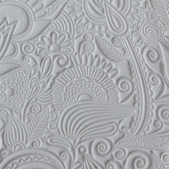 sample in clay of Mega Texture Tile - Flower Doodle. Use to impress texture in soft clays. Mega Texture Tiles are perfect for projects both large and small. Mega Tiles measure 9-1/4" x 6" and are about 7 times larger than Texture Tiles. These textures are flexible, washable and can be used with any soft clay.