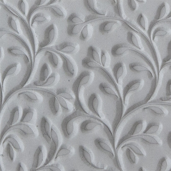 sample in clay of Mega Texture Tile - Wall of Vines. Use to impress texture in soft clays. Mega Texture Tiles are perfect for projects both large and small. Mega Tiles measure 9-1/4" x 6" and are about 7 times larger than Texture Tiles. These textures are flexible, washable and can be used with any soft clay.