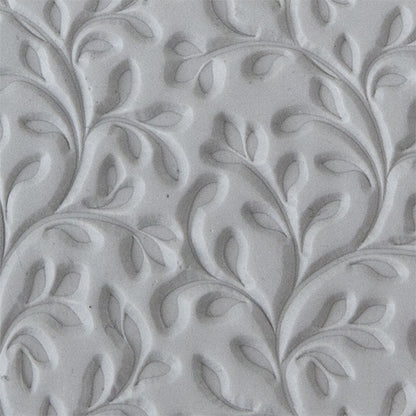 sample in clay of Mega Texture Tile - Wall of Vines. Use to impress texture in soft clays. Mega Texture Tiles are perfect for projects both large and small. Mega Tiles measure 9-1/4" x 6" and are about 7 times larger than Texture Tiles. These textures are flexible, washable and can be used with any soft clay.