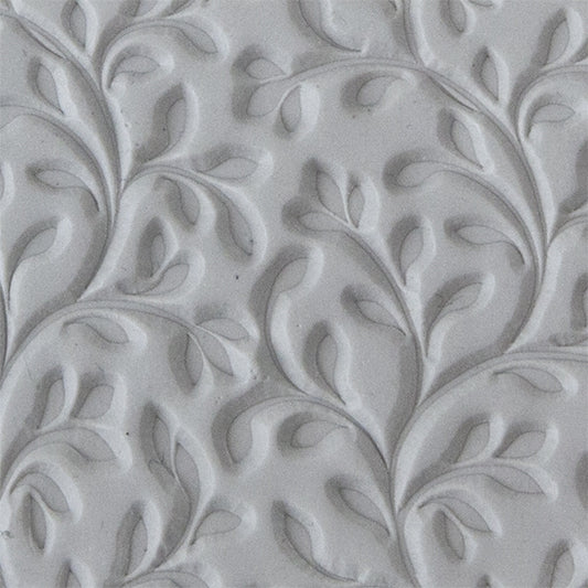 sample in clay of Mega Texture Tile - Wall of Vines. Use to impress texture in soft clays. Mega Texture Tiles are perfect for projects both large and small. Mega Tiles measure 9-1/4" x 6" and are about 7 times larger than Texture Tiles. These textures are flexible, washable and can be used with any soft clay.