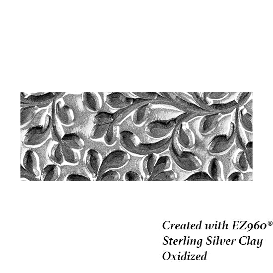 silver sample of Mega Texture Tile - Wall of Vines. Use to impress texture in soft clays. Mega Texture Tiles are perfect for projects both large and small. Mega Tiles measure 9-1/4" x 6" and are about 7 times larger than Texture Tiles. These textures are flexible, washable and can be used with any soft clay.