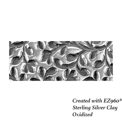 silver sample of Mega Texture Tile - Wall of Vines. Use to impress texture in soft clays. Mega Texture Tiles are perfect for projects both large and small. Mega Tiles measure 9-1/4" x 6" and are about 7 times larger than Texture Tiles. These textures are flexible, washable and can be used with any soft clay.
