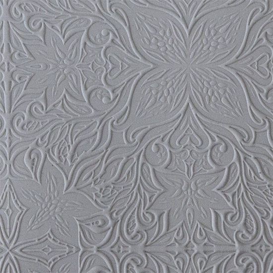 sample in clay of Mega Texture Tile - Woodcut Floral. Use to impress texture in soft clays. Mega Texture Tiles are perfect for projects both large and small. Mega Tiles measure 9-1/4" x 6" and are about 7 times larger than Texture Tiles. These textures are flexible, washable and can be used with any soft clay.