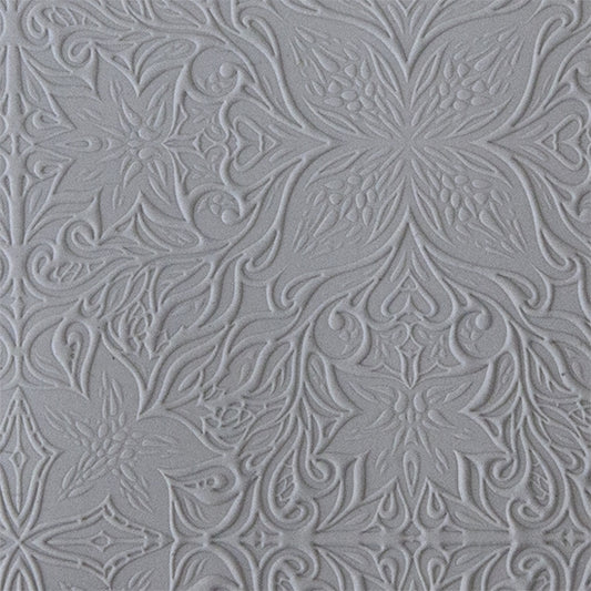 sample in clay of Mega Texture Tile - Woodcut Floral. Use to impress texture in soft clays. Mega Texture Tiles are perfect for projects both large and small. Mega Tiles measure 9-1/4" x 6" and are about 7 times larger than Texture Tiles. These textures are flexible, washable and can be used with any soft clay.