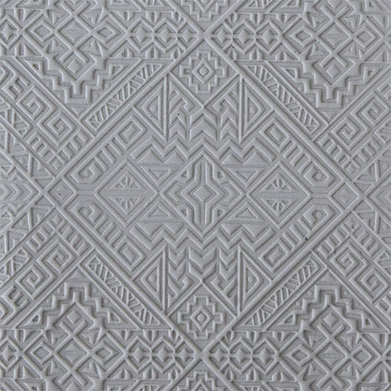 sample in clay of Mega Texture Tile - Navajo Rug. Use to impress texture in soft clays. Mega Texture Tiles are perfect for projects both large and small. Mega Tiles measure 9-1/4" x 6" and are about 7 times larger than Texture Tiles. These textures are flexible, washable and can be used with any soft clay.