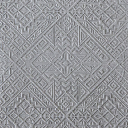 sample in clay of Mega Texture Tile - Navajo Rug. Use to impress texture in soft clays. Mega Texture Tiles are perfect for projects both large and small. Mega Tiles measure 9-1/4" x 6" and are about 7 times larger than Texture Tiles. These textures are flexible, washable and can be used with any soft clay.