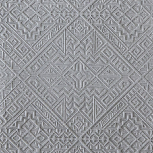 sample in clay of Mega Texture Tile - Navajo Rug. Use to impress texture in soft clays. Mega Texture Tiles are perfect for projects both large and small. Mega Tiles measure 9-1/4" x 6" and are about 7 times larger than Texture Tiles. These textures are flexible, washable and can be used with any soft clay.