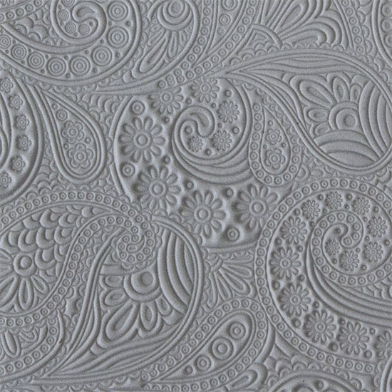 sample in clay of Mega Texture Tile - Waves of Paisley. Use to impress texture in soft clays. Mega Texture Tiles are perfect for projects both large and small. Mega Tiles measure 9-1/4" x 6" and are about 7 times larger than Texture Tiles. These textures are flexible, washable and can be used with any soft clay.